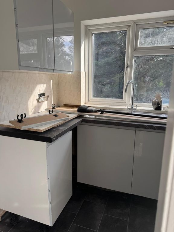 Property photo 1 of 4 Charming Two-Bedroom Home With Spacious Garden And Modern Kitchen