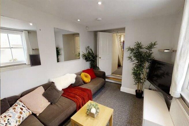 Property photo 2 of 3 A Bright, Inviting Living Room Featuring Comfortab...