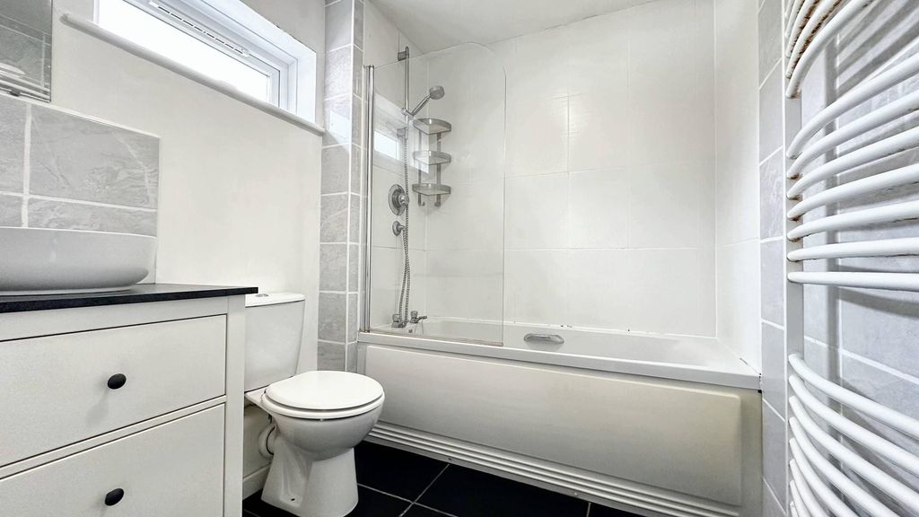 Property photo 2 of 9 Pristine Modern Bathroom With Full Bath And Shower...