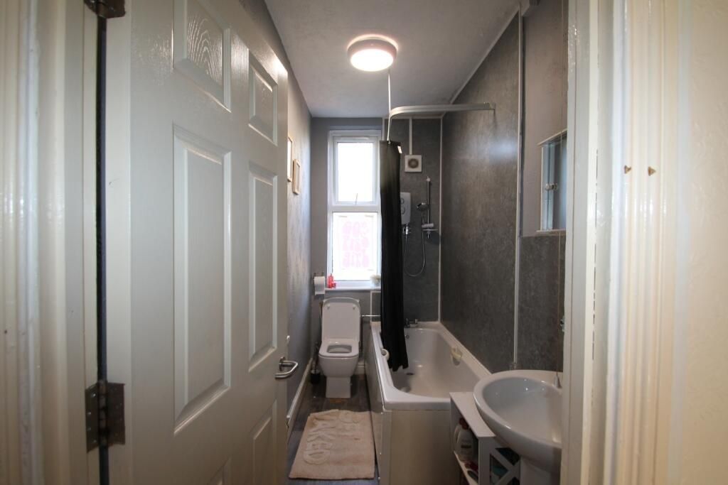 Property photo 1 of 7 Bright And Functional Bathroom Featuring A Bathtub...