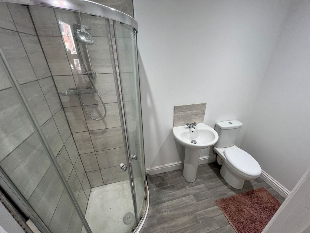 Property photo 2 of 5 Modern Bathroom Featuring A Curved Glass Shower En...