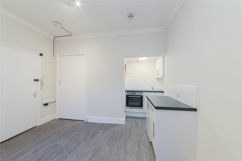 Property photo 1 of 7 Kitchen Area