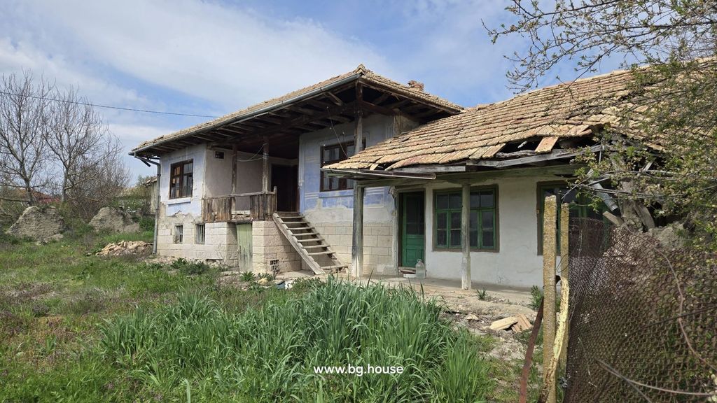 Property photo 2 of 48 Side Perspective Of A Bulgarian House Featuring Stone Basement, Wooden Balcony, Tiled Roof, And Green Doors And Windows.