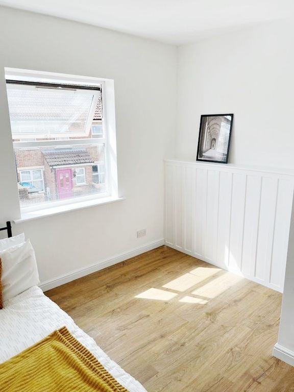 Property photo 3 of 5 Bright, Freshly Painted Bedroom With Warm Wood Flo...