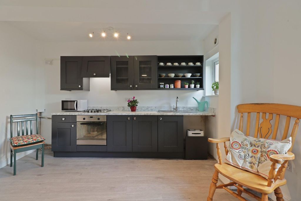 Property photo 3 of 17 Dining Kitchen