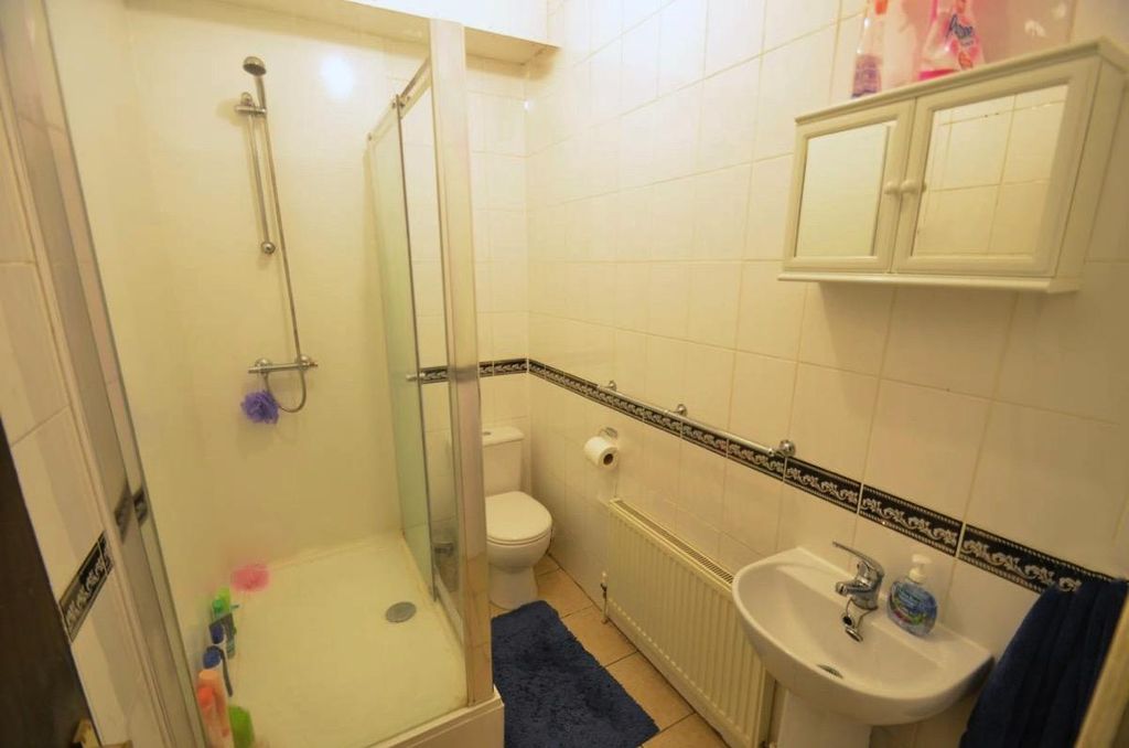Property photo 2 of 15 Well-Maintained Bathroom With A Corner Glass Showe...