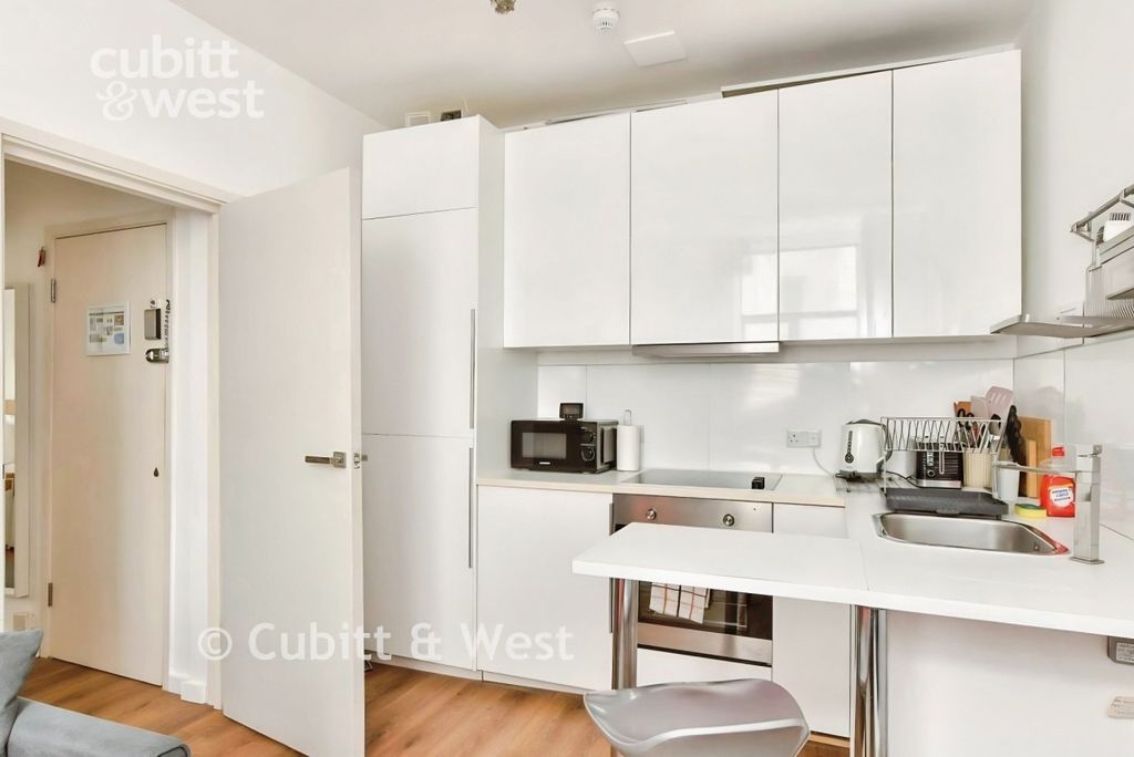 Property photo 2 of 12 Kitchen Area