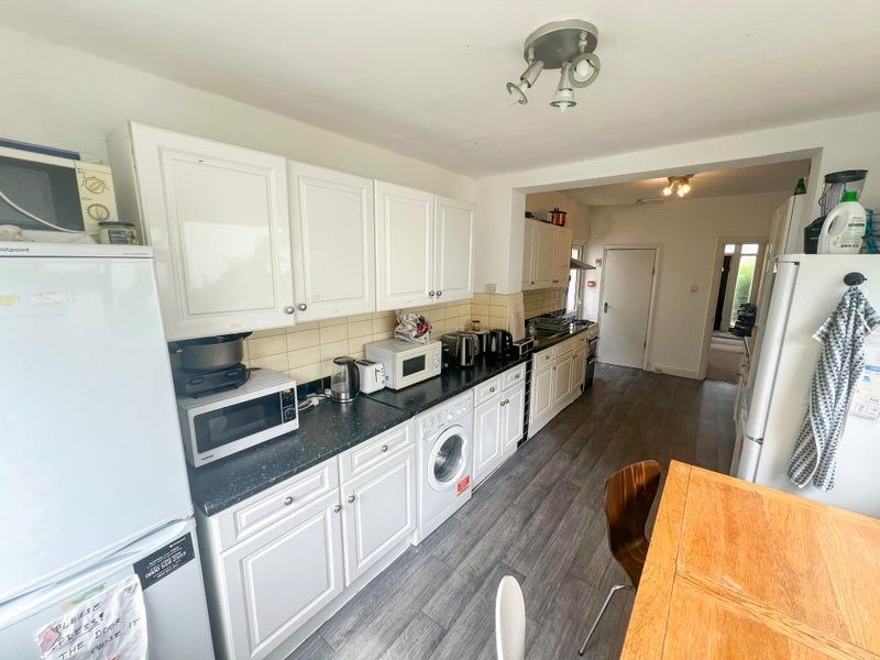 Property photo 3 of 6 Bright And Modern Kitchen Featuring Ample Cabinetr...