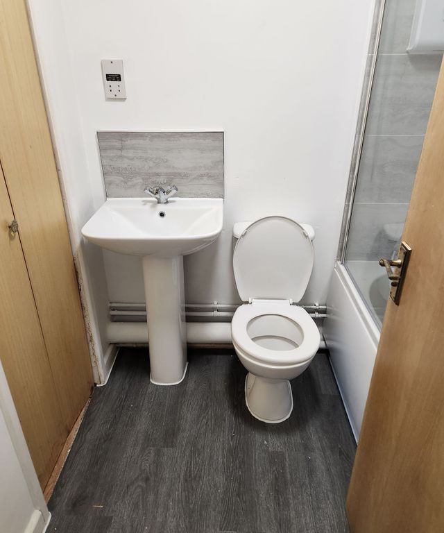 Property photo 2 of 4 Bright Bathroom With Contemporary White Fixtures...