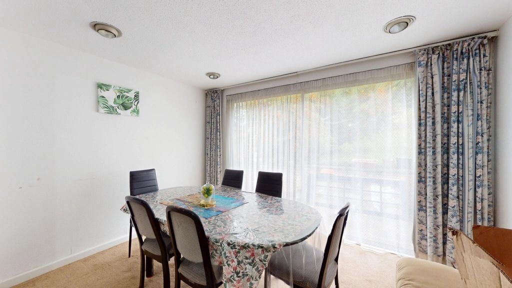 Property photo 1 of 12 A Bright And Welcoming Living Room With A Large Wi...