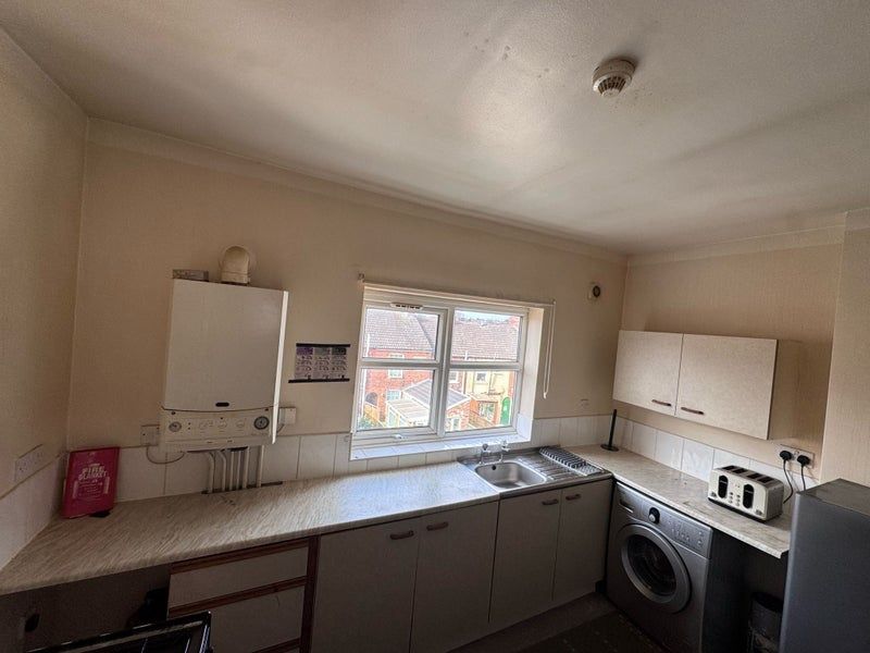 Property photo 2 of 5 A Practical Kitchen Featuring A Large Window Provi...
