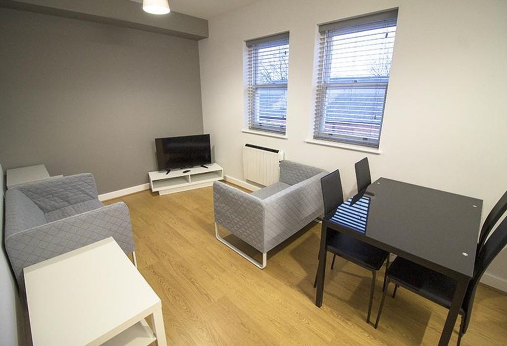 Property photo 1 of 5 Spacious Living Area Featuring Modern Furnishings,...