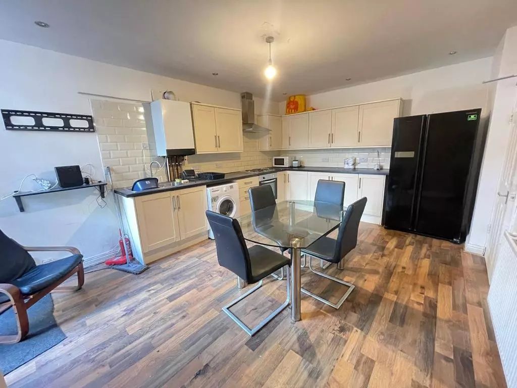 Property photo 1 of 5 Bright And Modern Kitchen Featuring A Spacious Lay...