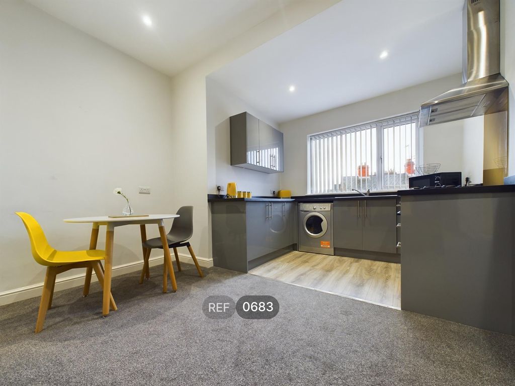 Property photo 2 of 8 Kitchen/Living Area