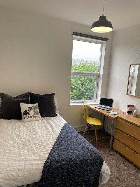 Property photo 2 of 15 A Charming Double Bedroom Featuring A Cozy Bed, A ...