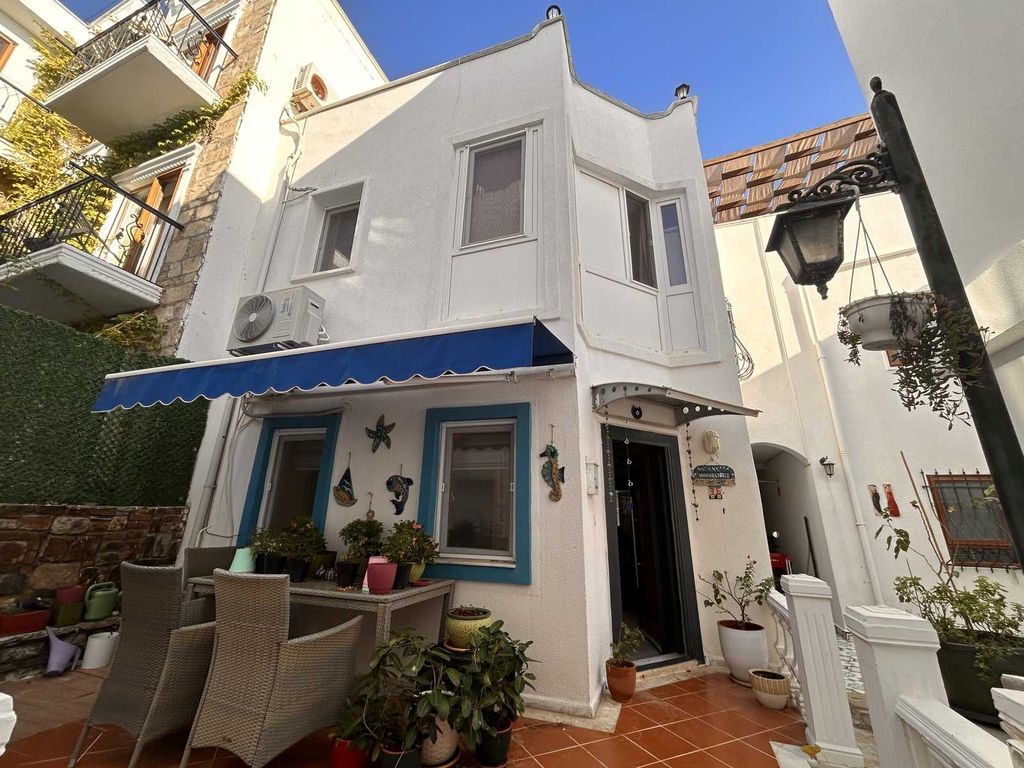 Property photo 2 of 22 A Pretty Semi-Detached Triplex Villa In Bodrum For Sale - Terrace And Main Entrance