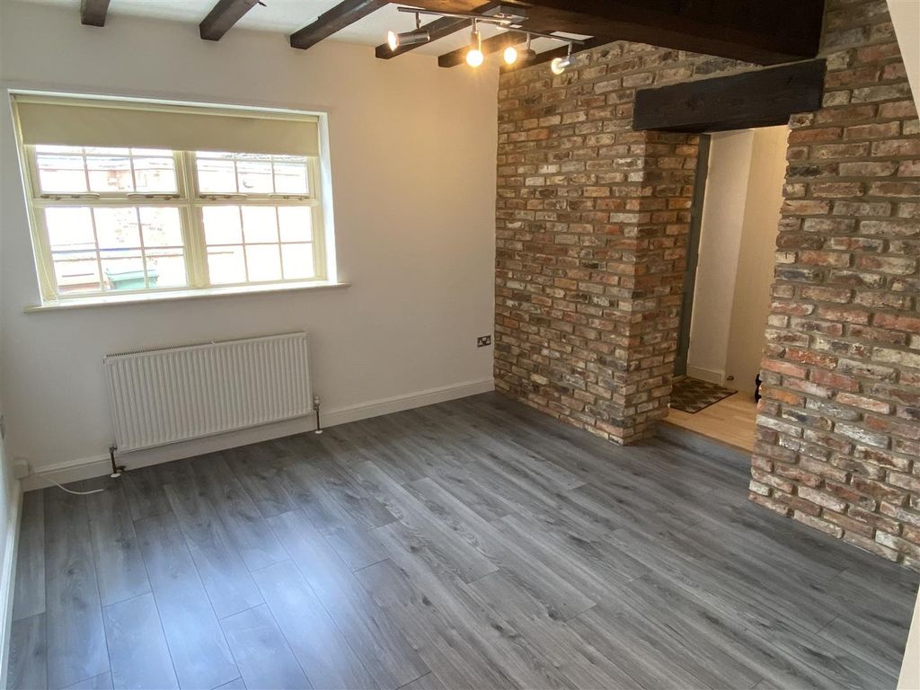Property photo 3 of 6 Charming Living Area With Feature Brick Wall...