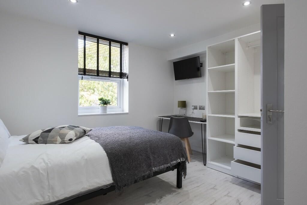 Property photo 1 of 15 A Bright And Well-Maintained Bedroom Featuring A d...