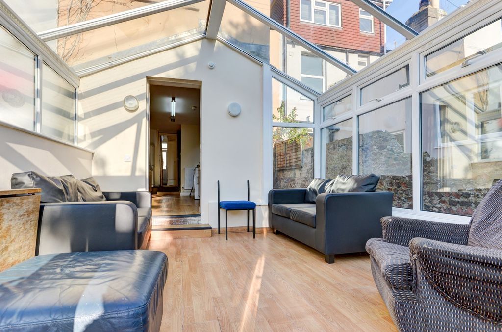 Property photo 1 of 19 Bright Conservatory-Style Living Area With Large W...