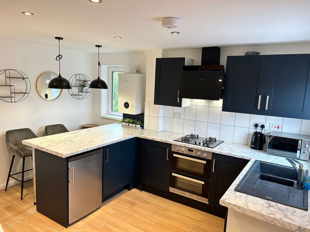 Property photo 2 of 8 Living Room + Kitchen