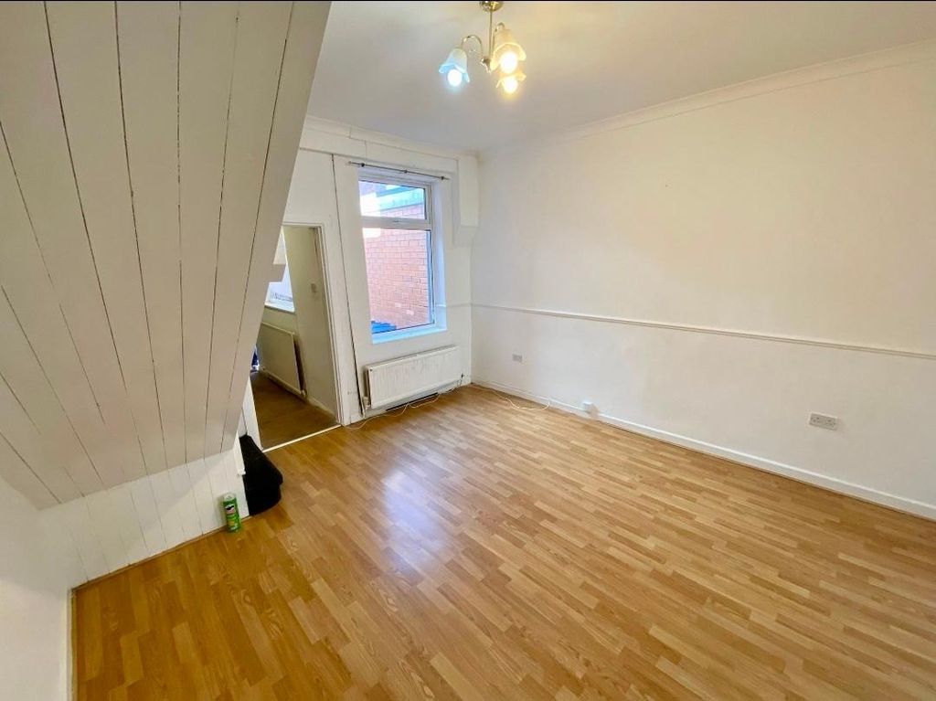 Property photo 1 of 10 Bright, Freshly Painted Living Room With Wood-Effe...