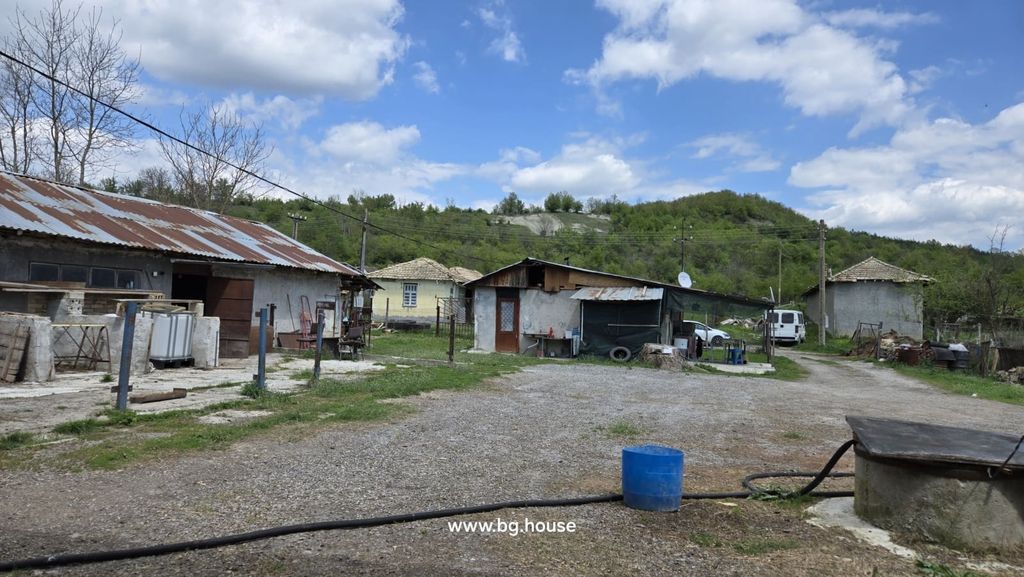 Property photo 2 of 54 View Of Multiple Farm Buildings And A Yard Area With Gravel And Grass, Surrounded By Trees And Hills.