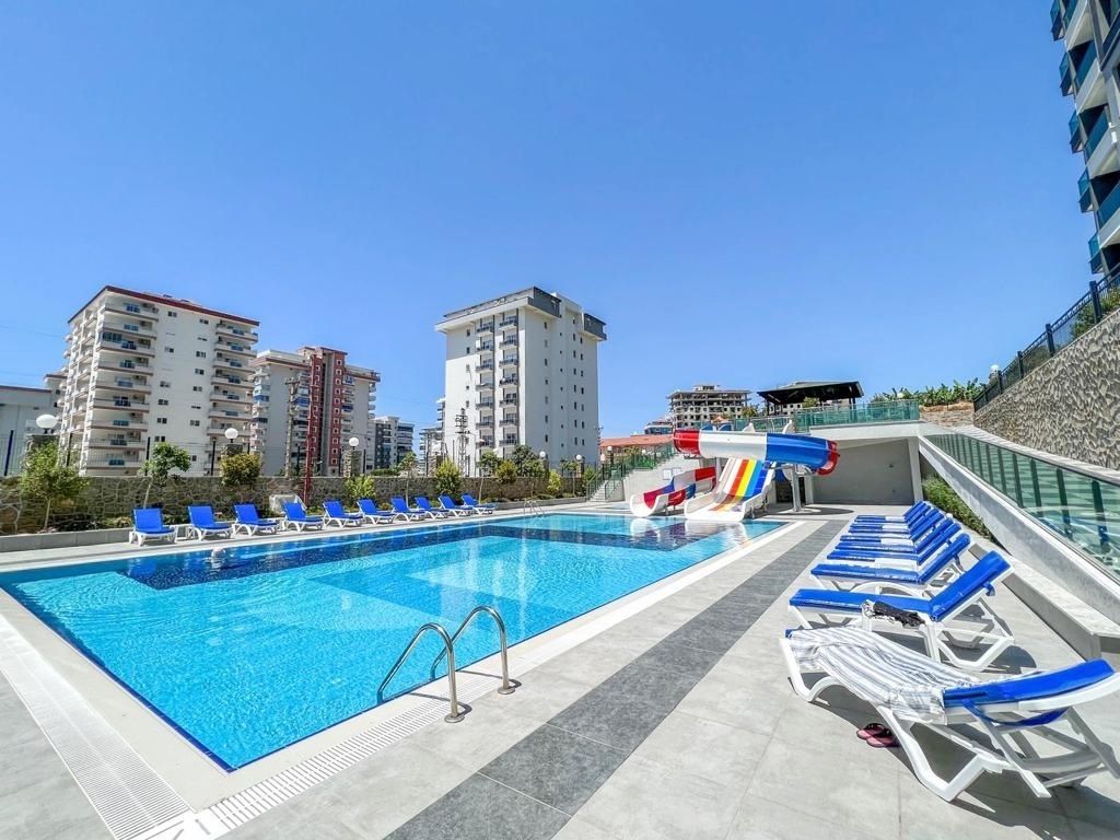 Property photo 2 of 23 A Trendy Property In Alanya Is For Sale – Communal Outdoor Pool And Sunbathing Terraces