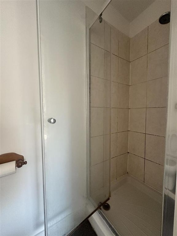 Property photo 3 of 8 Bright Bathroom With A Sleek Glass Shower Unit...