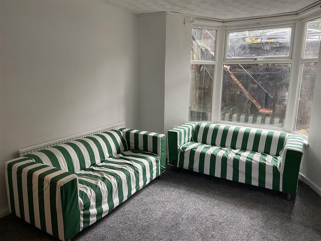 Property photo 2 of 4 Bright Lounge Area With Stylish Striped Seating...