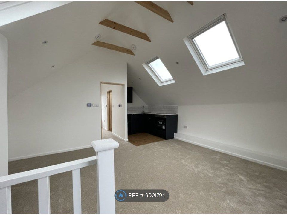 Property photo 2 of 7 Living Room + Kitchenette