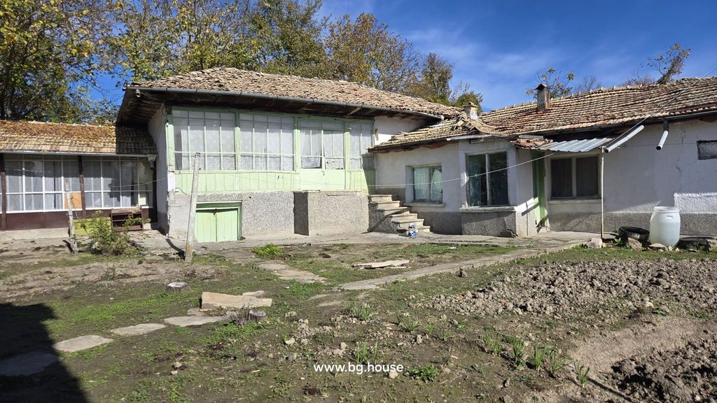 Property photo 2 of 58 Back Of The Bulgarian House Featuring An Enclosed Porch With Large Windows And Stone Steps Leading To The Yard