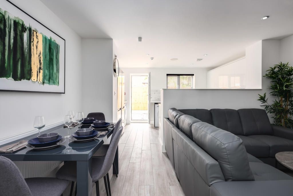 Property photo 1 of 14 Bright And Modern Living Room Featuring Comfortabl...