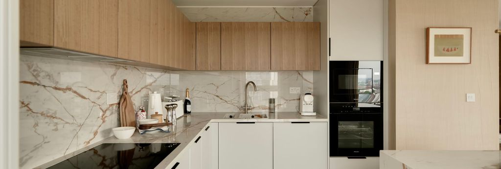 Property photo 1 of 4 Kitchen With Marble Textured Splashback Tiles, Mod Con Appliances, Off-White And Wooden Design.