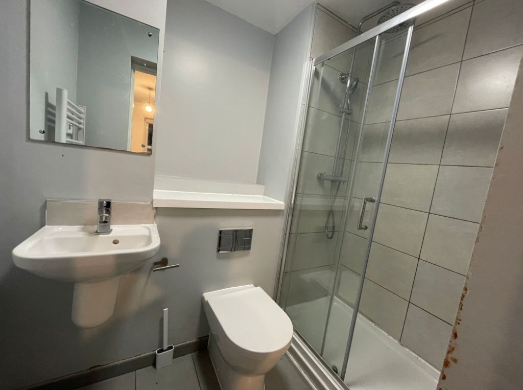 Property photo 3 of 3 A Modern Bathroom Featuring A Clean White Sink, A ...