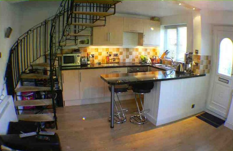 Property photo 2 of 6 Staircase And Kitchen