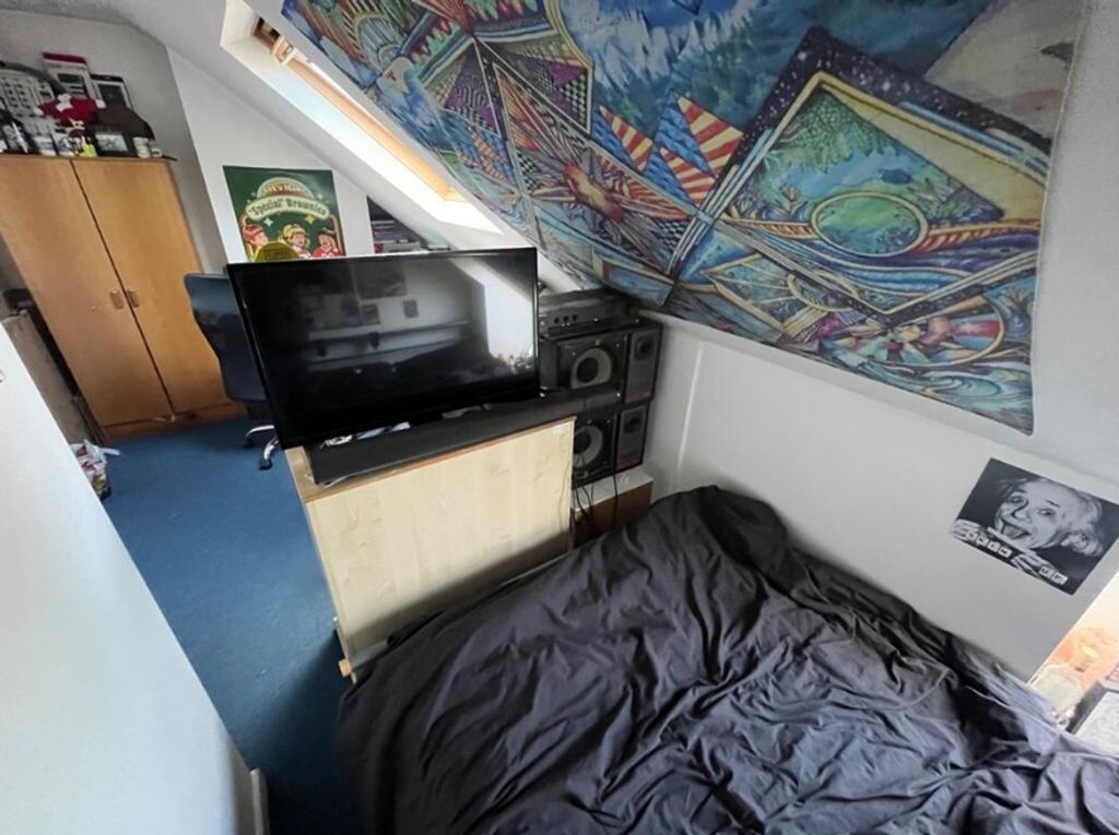 Property photo 3 of 12 A Cozy Double Bedroom Featuring Vibrant Decor And ...