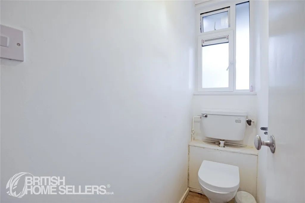 Property photo 1 of 8 A Clean, Compact Bathroom With A White Toilet And ...