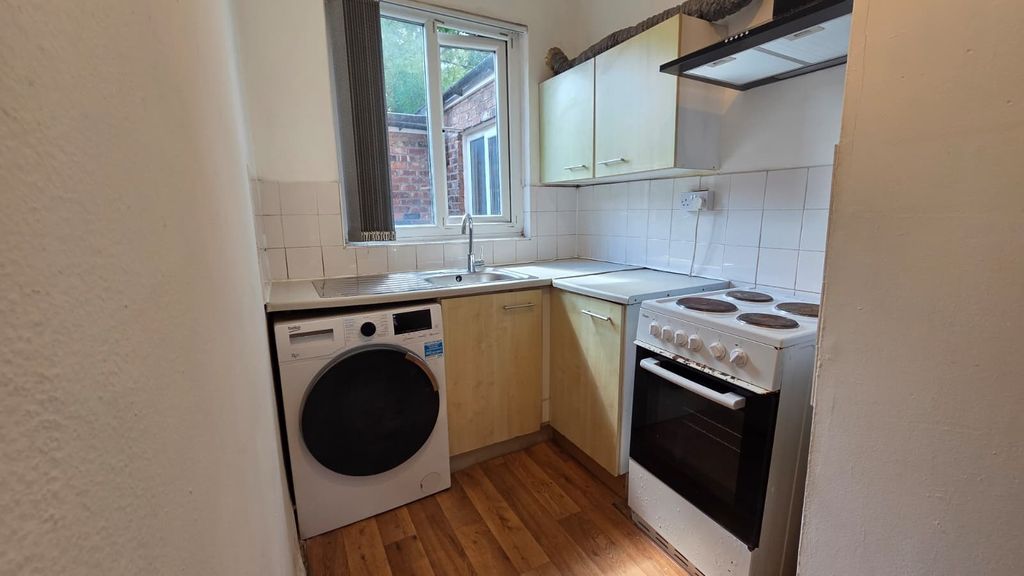 Property photo 3 of 6 Compact Fitted Kitchen With A Sink Under A Window,...