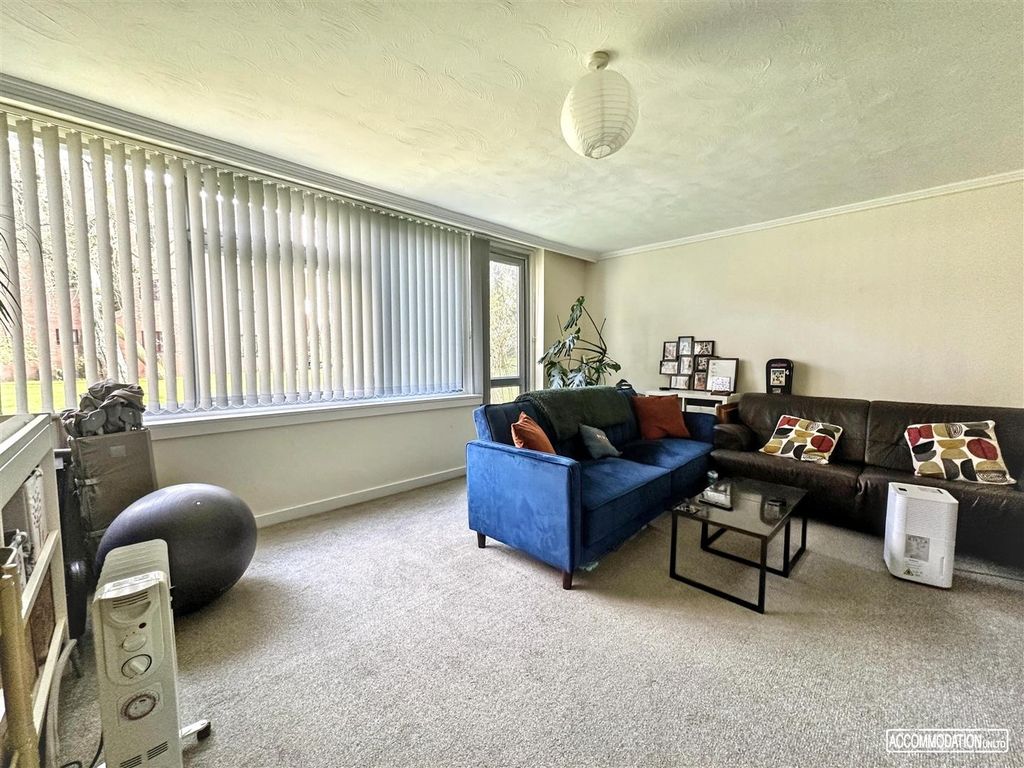 Property photo 2 of 10 Bright Lounge With Large Window And Modern Seating...