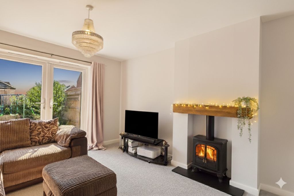 Property photo 2 of 31 An Electric Fireplace Making A Cosy Lounge