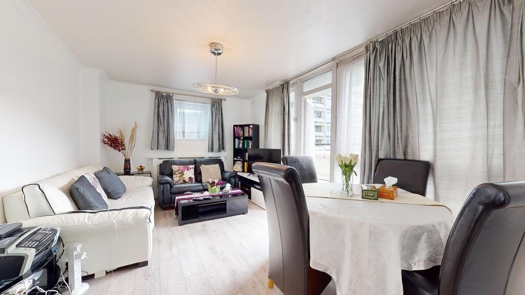 Property photo 2 of 19 A Spacious And Well-Lit Living Room Featuring A Co...