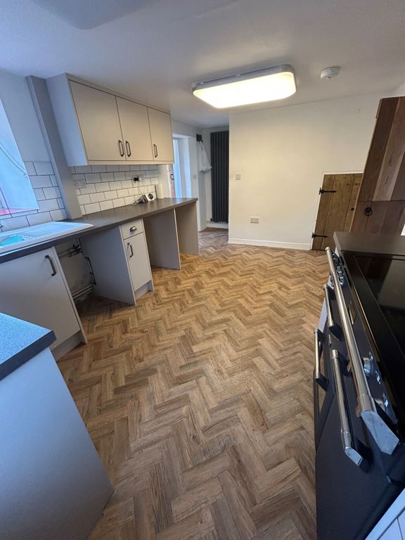 Property photo 3 of 12 Kitchen Side View