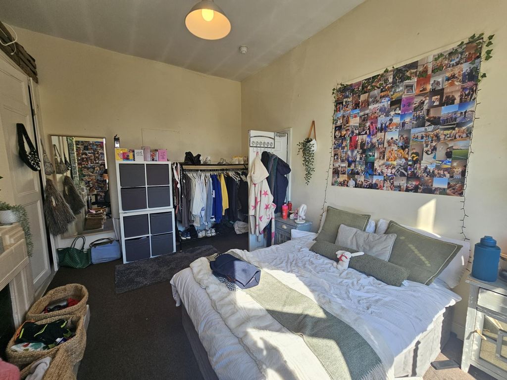 Property photo 2 of 10 Bright And Inviting Master Bedroom Featuring A Coz...