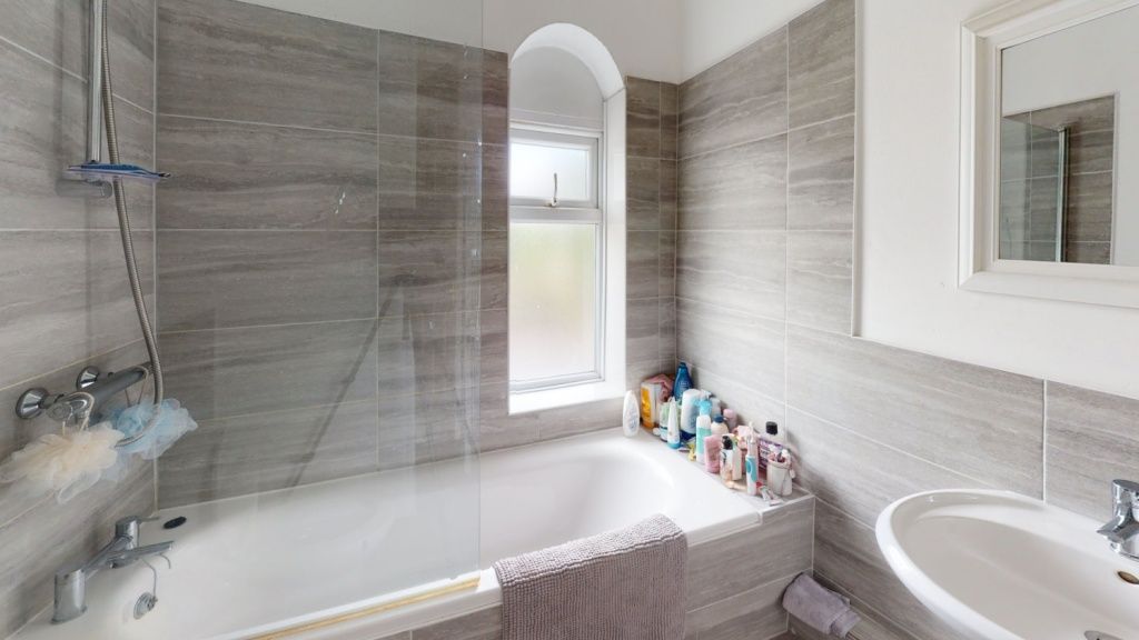 Property photo 2 of 7 A Modern Bathroom Suite Featuring A Bathtub With A...