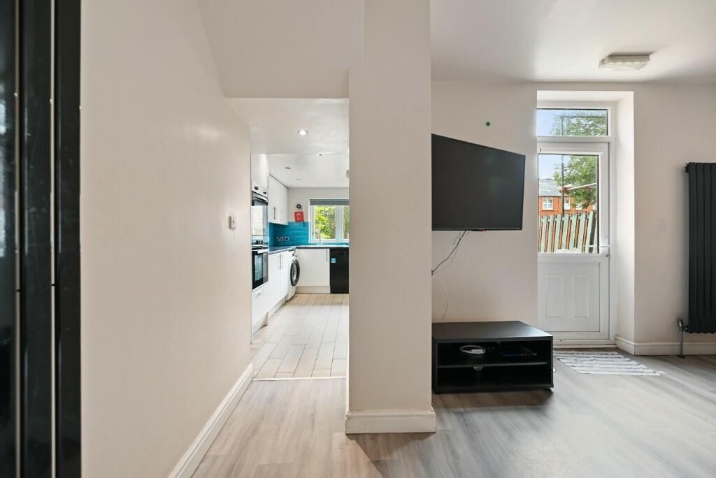 Property photo 2 of 13 A Bright And Modern Living Space Featuring Light W...
