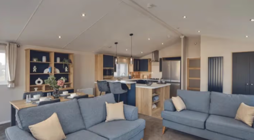 Property photo 1 of 4 Open Plan Lounge With Blue Sofas, Dining Area And Modern Kitchen