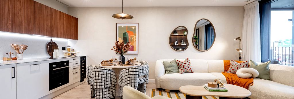 Property photo 1 of 4 From Left: Kitchenette, Dining Table, L-Shaped Sofa, Coffee Table, Balcony Doors