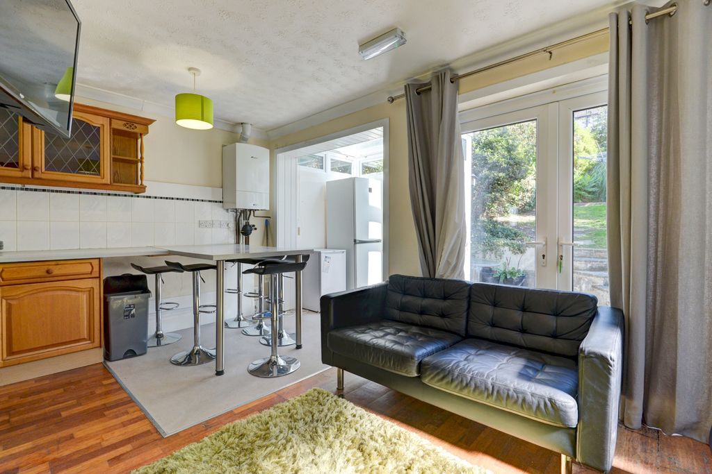 Property photo 3 of 24 Bright And Welcoming Living Area Featuring A Styli...