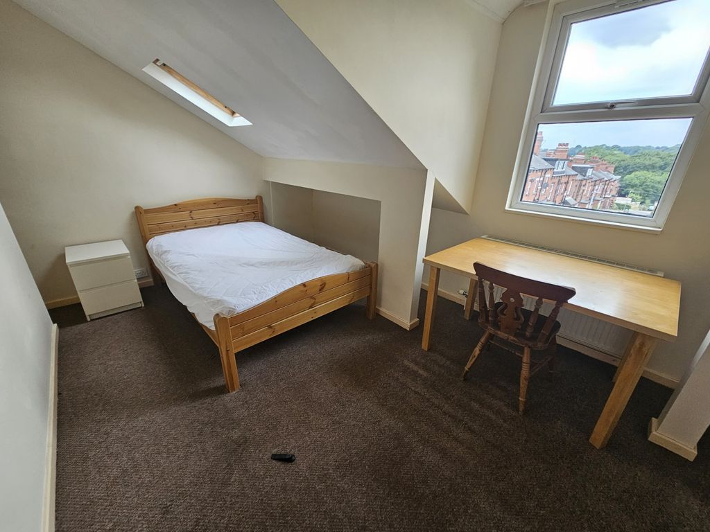 Property photo 3 of 15 Cozy Double Bedroom Featuring A Comfortable Wooden...