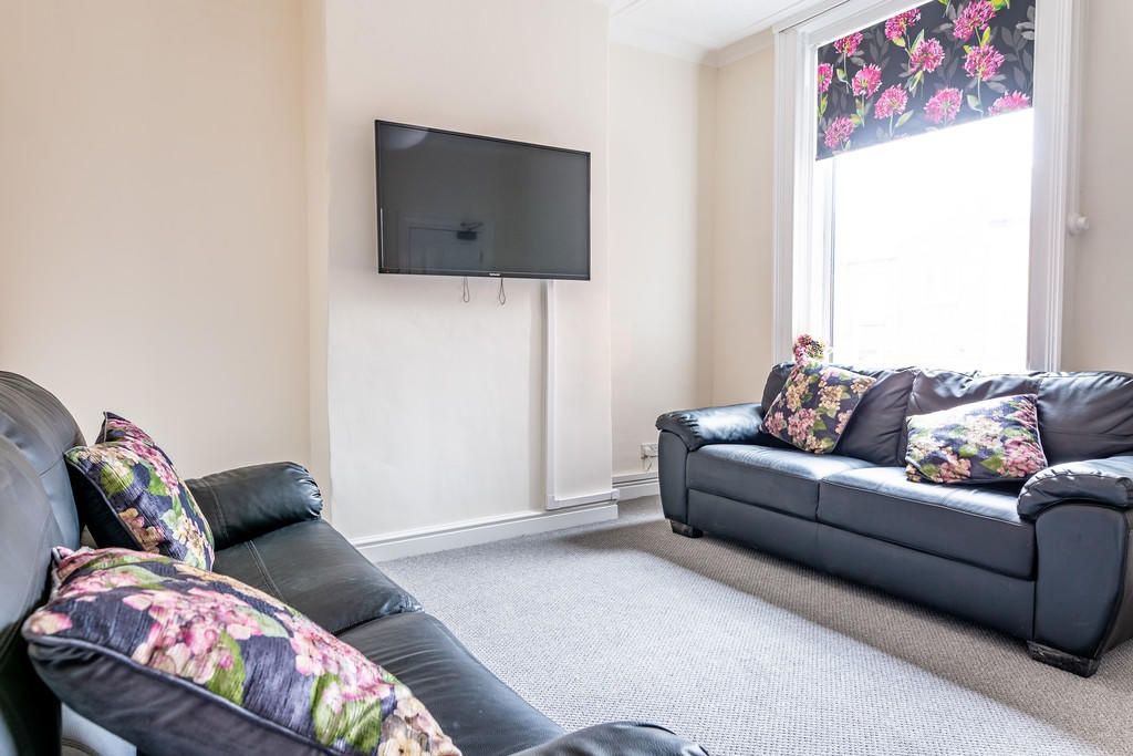 Property photo 3 of 9 Bright Living Room With Two Black Leather Sofas Ad...
